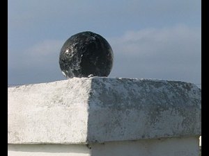 Old glass net floats are a popular pillar ornament.