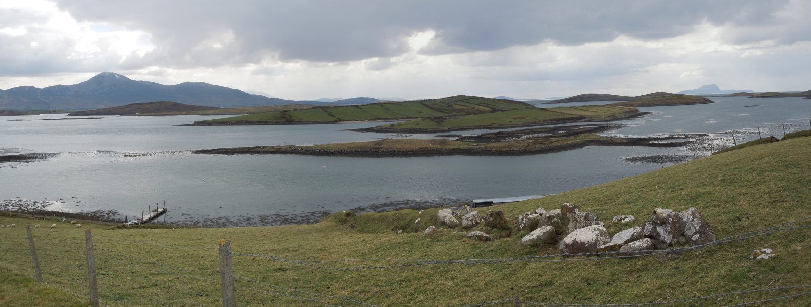 The view of Croagh Patrick (left) and of various Clew Bay islands from Inishnakillew. Faintly visible in the distance towards the right is the hump of Clare Island