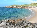 Beach beside the pier at the northern end of Cruit