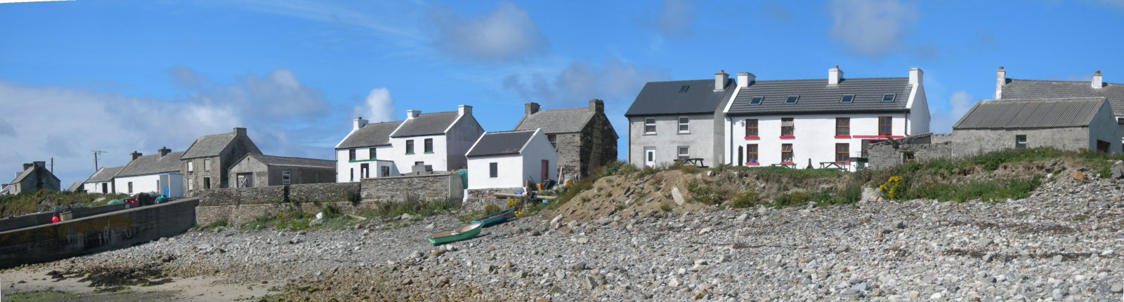 part of the main cluster of houses on Inishbofin which run along the shore by the pier