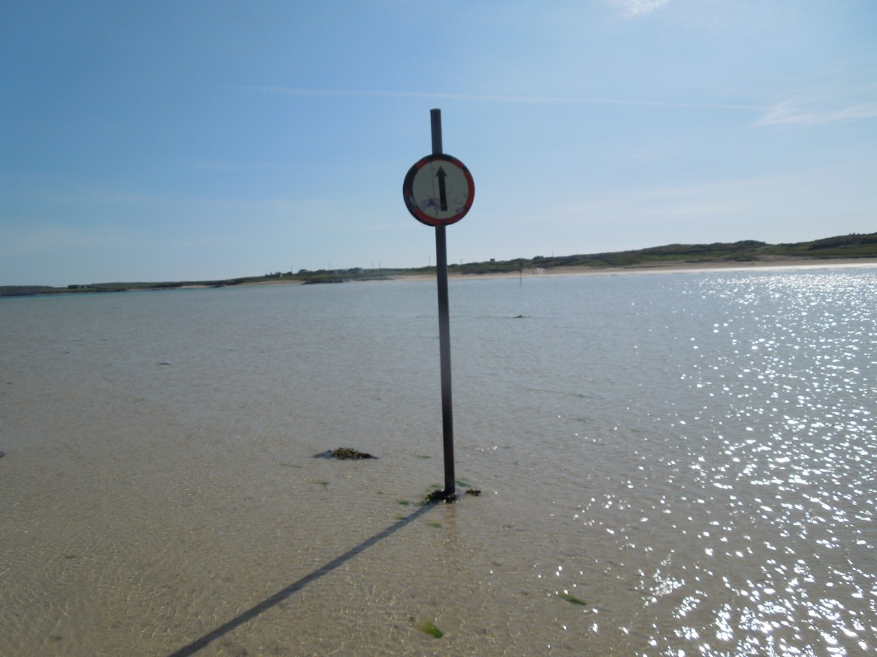 The 'road' to and from the island is clear at low tide.