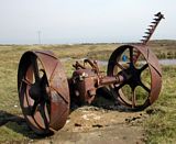 An old machine for cutting hay rusting at the side of the road near the Eeat Lighthouse