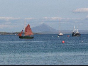 A traditional sailing hooker with Croagh Patrick (The Reek) in the background